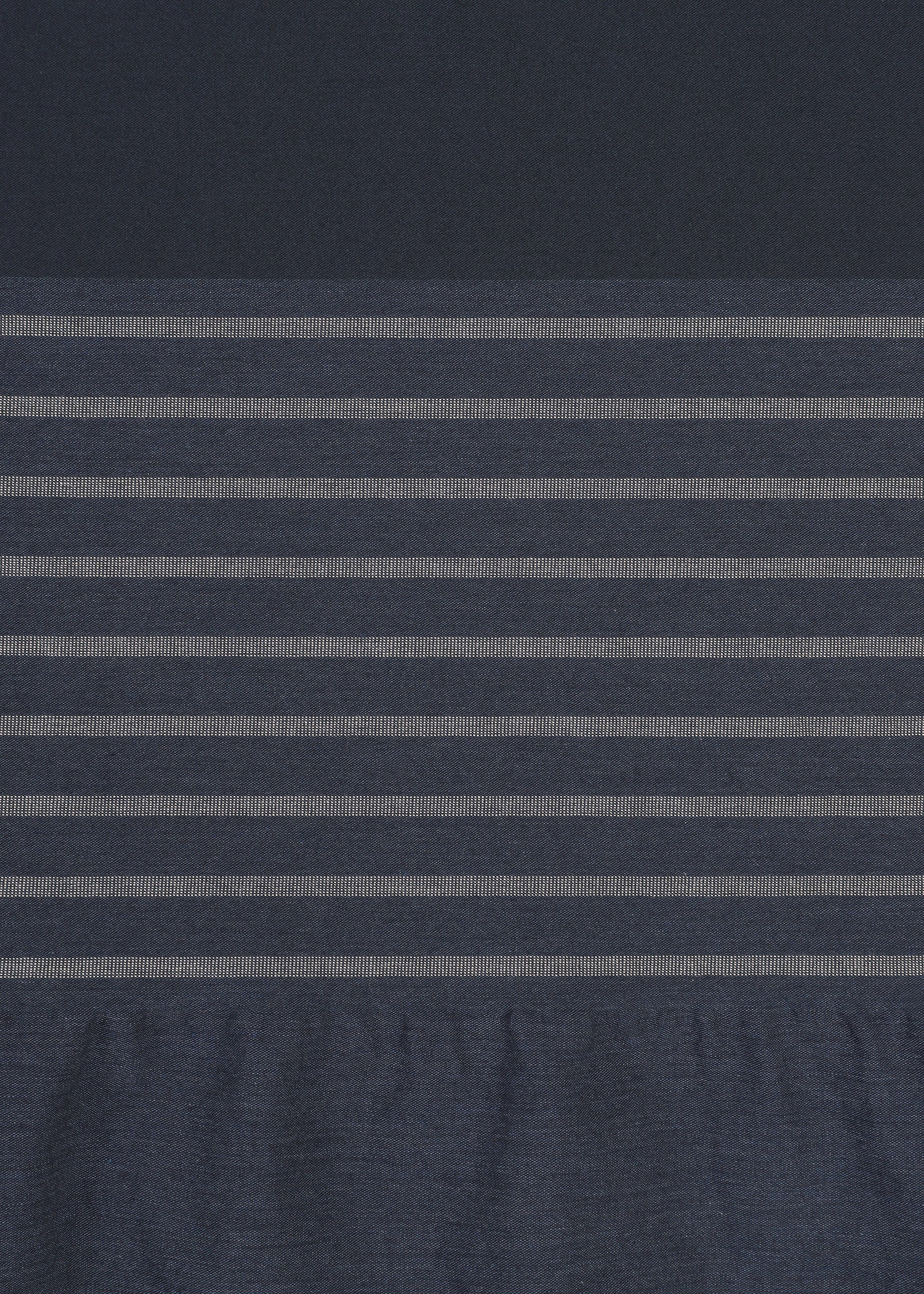 Zoomed view A subtle striped pattern is created on the COLLAGE STRETCH Ⅱ by HaaT, featuring a central horizontal section of dark blue fabric with evenly spaced thin light gray stripes, bordered above by solid dark blue fabric and below by slightly wrinkled blue fabric.
