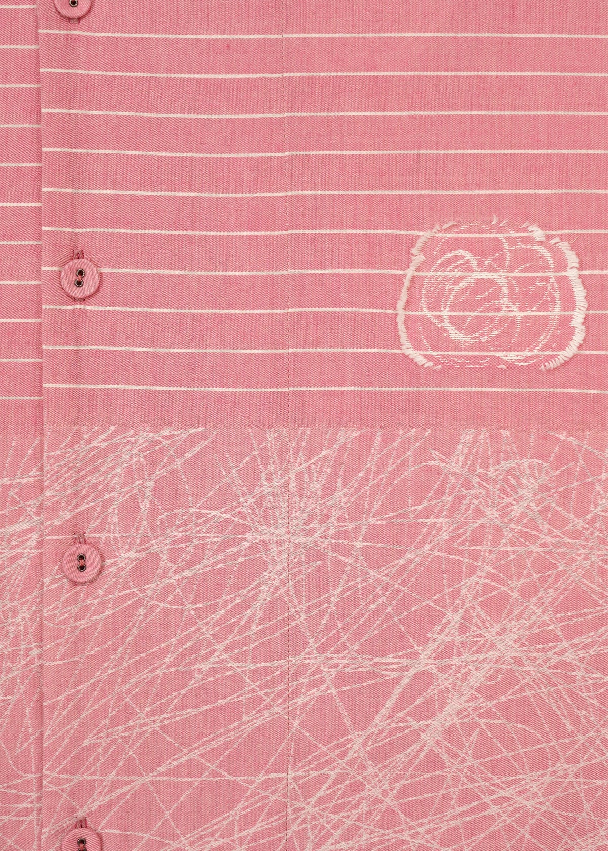 Close-up of HaaT's ONE STROKE DRAW: a pink cotton cupra dress with white buttons, horizontal white stripes, an abstract circular design, and a crisscrossing white pattern near the hem. view 6 of 9