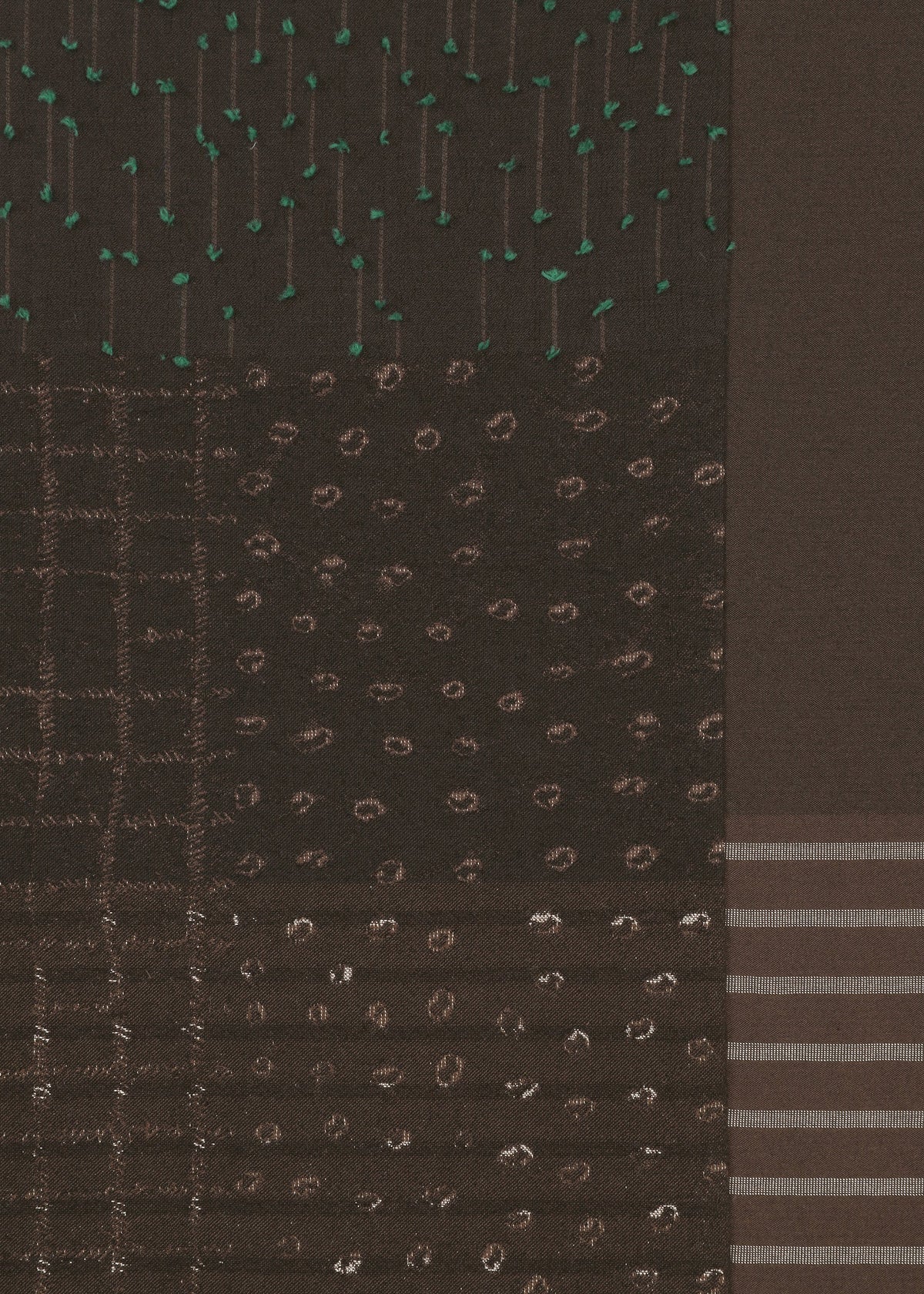 The COLLAGE STRETCH Ⅰ by HaaT features a dark fabric adorned with sections of various stitched patterns—dots, dashes, vertical lines, and horizontal stripes in green and brown threads—creating a geometric and textured design reminiscent of jacquard weaving. view 5 of 8