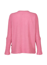 A back view of the HaaT KYO CHIJIMI 2WAY top in pink reveals its textured, round-neck, long-sleeve design with a relaxed fit and no visible fastenings or patterns. The lightweight piece features a slightly crinkled surface, characteristic of its unique product dyeing process.
