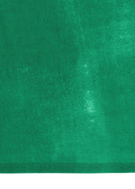 A close-up of WALL WHITE HEM by HaaT reveals green textured fabric with a distinct border and varied green shades, evoking Kyoto dyeing techniques.