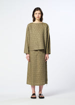 A person stands facing forward, wearing the HOLE & LINE cupra-blend textured long-sleeve top and matching long skirt by HaaT in olive green, paired with black sandals, against a plain light background.