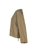 Side view of a long-sleeve, light brown twill fabric top with a subtle pattern and drawstring detail on the side, photographed against a white background.