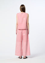 A person with long, straight hair faces away, wearing HaaT's ONE STROKE DRAW jacquard sleeveless top and matching wide-leg pants in a textured cotton cupra blend, paired with black sandals against a plain white background.