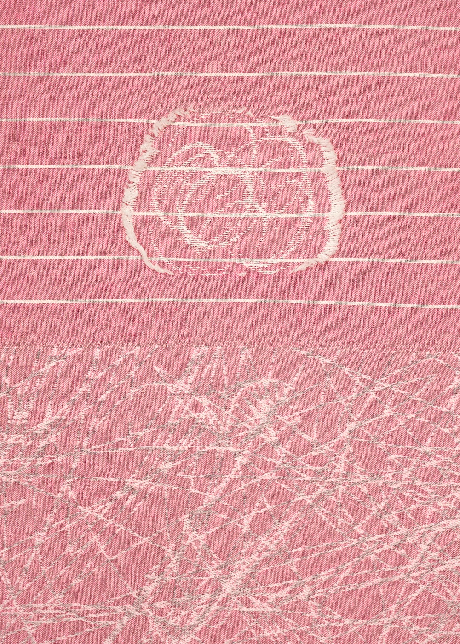 Zoomed view The ONE STROKE DRAW top by HaaT is a pink jacquard long-sleeve featuring horizontal white lines, a distressed circular patch at the top center, and overlapping white scratch-like details on the lower half.