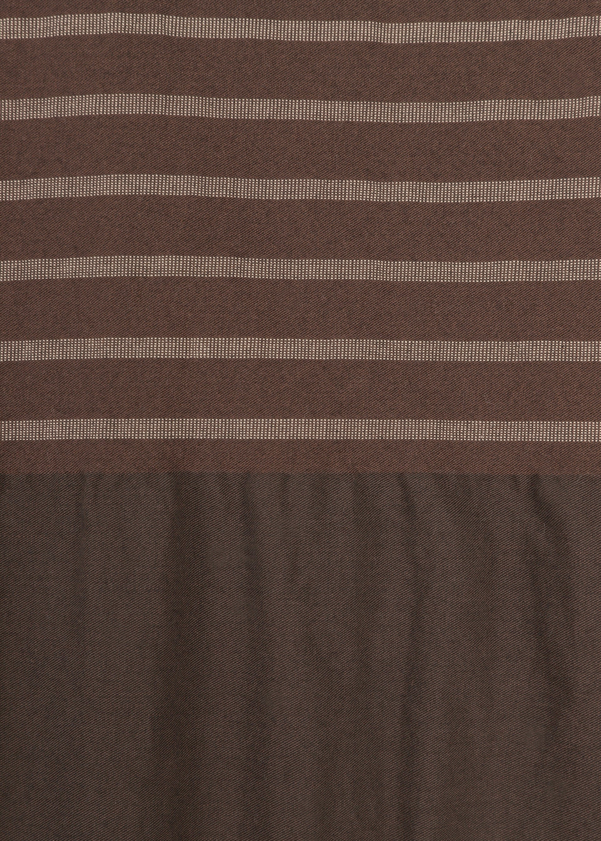 Zoomed view COLLAGE STRETCH Ⅱ by HaaT is crafted from brown fabric with a relaxed silhouette, showcasing horizontal light beige stripes on the upper section that evoke the look of a striped short-sleeved top, while the lower section transitions to a solid brown with a gently wrinkled texture.