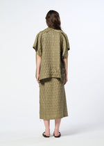 A person stands facing away, wearing the HaaT HOLE & LINE olive textured short-sleeve top with subtle eyelet embroidery and the matching mid-length skirt, paired with black sandals. The background is plain white.