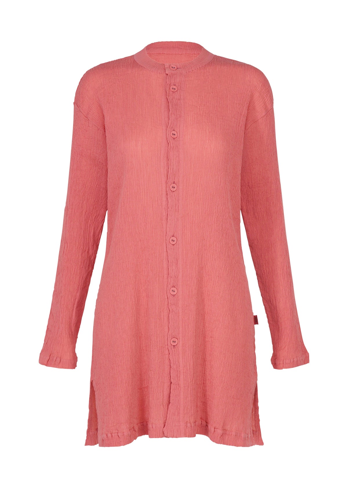 The KYO CHIJIMI AUGUST by HaaT is a long-sleeved, coral pink button-up tunic with a crinkled texture reminiscent of the signature KYO CHIJIMI cardigan. Featuring a relaxed fit, this shirt has a round neckline, side slits, and falls to mid-thigh length. view 1 of 7