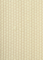 Close-up of HaaT’s SAKIORI: a beige textured fabric featuring a grid-like, woven pattern with a soft, slightly shiny surface reminiscent of traditional techniques.