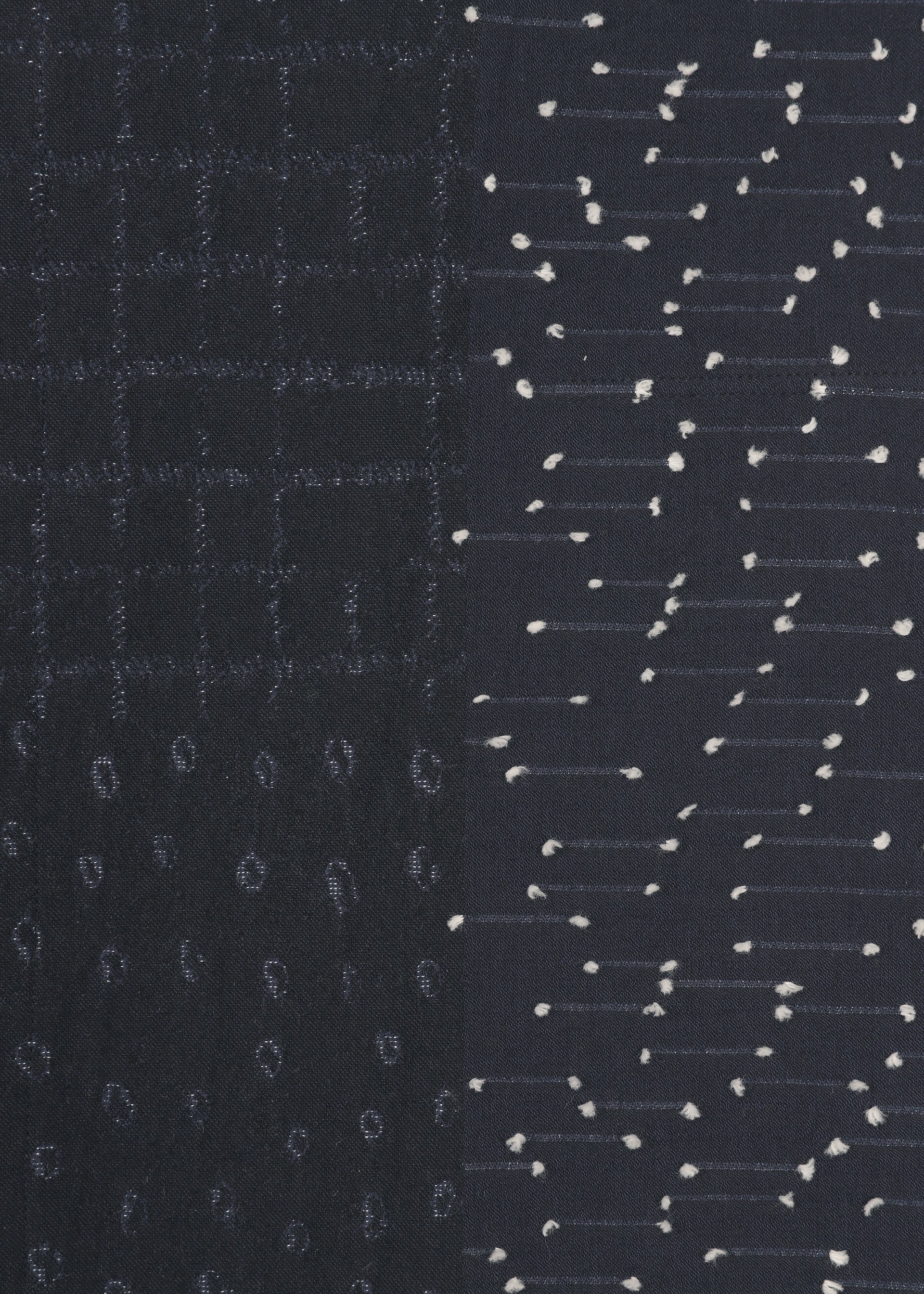 Zoomed view COLLAGE STRETCH Ⅰ by HaaT is a dark fabric showcasing three unique patterns: a jacquard weaving-inspired grid on the left, small vertical oval shapes at the bottom, and horizontal dashed lines accented with small white dots on the right.