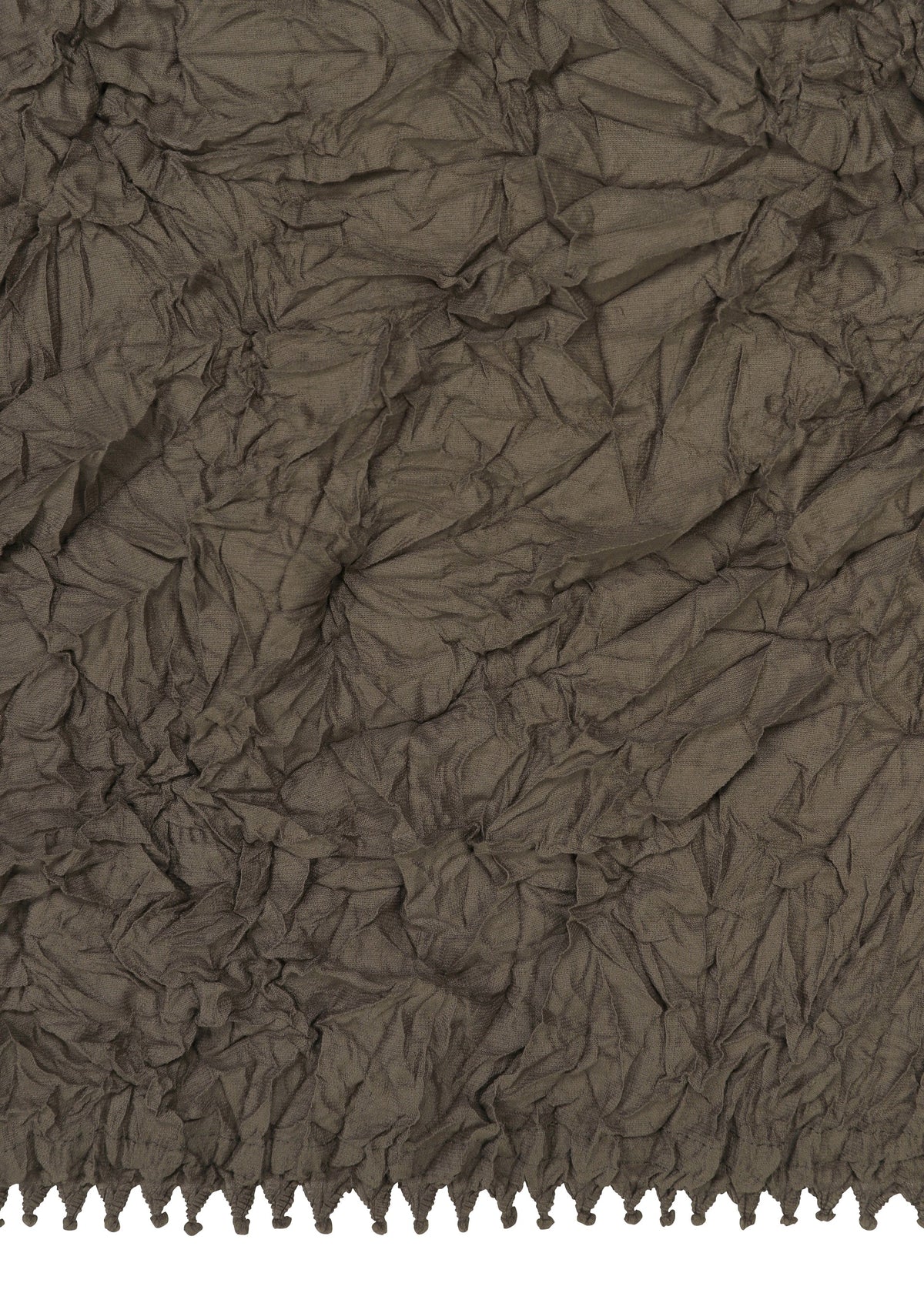 Zoomed view Crinkled brown KUMO SHIBORI fabric by HaaT features an uneven, textured surface and a row of small tassels or fringe along the bottom edge, inspired by traditional Shibori techniques.