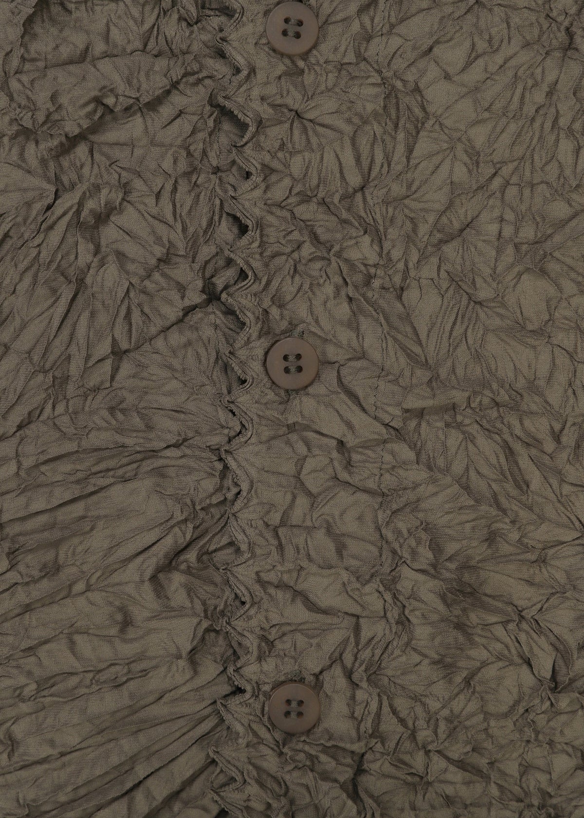 Zoomed view Close-up of crinkled brown fabric with four brown buttons and decorative stitching, evoking KUMO SHIBORI by HaaT on a high-neck cardigan.