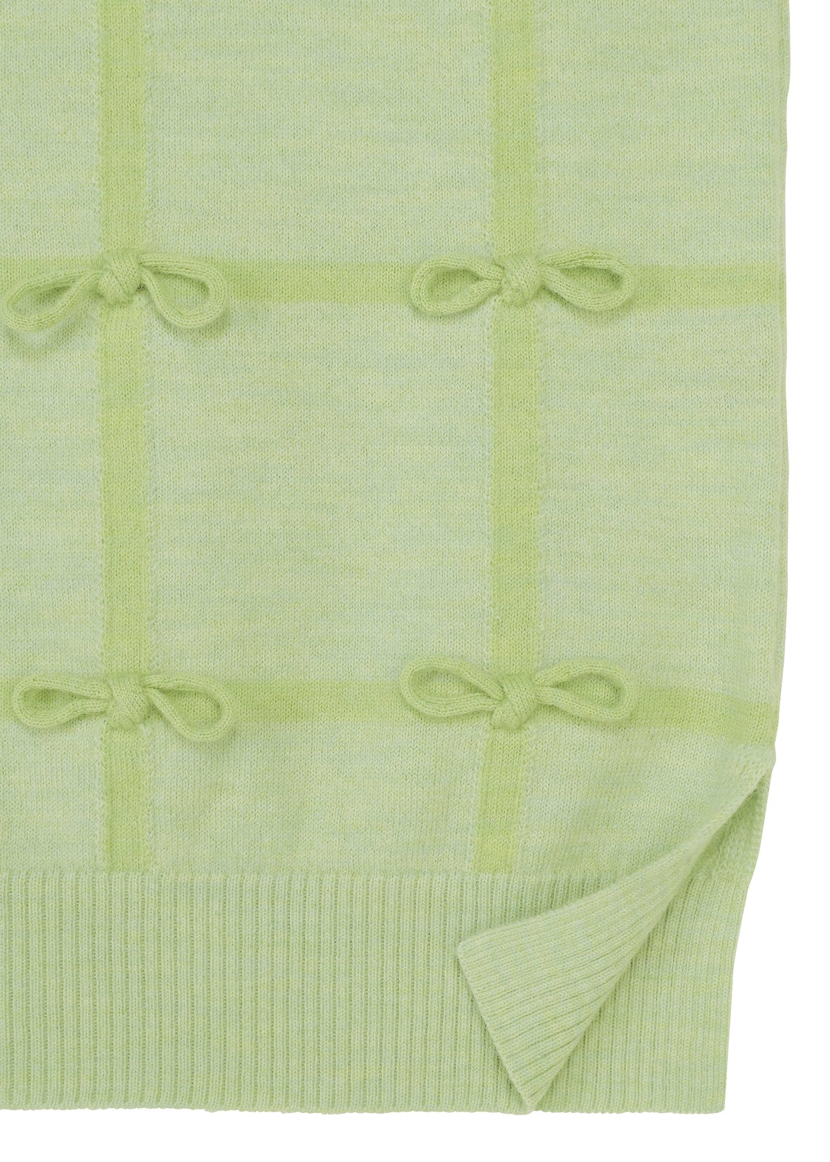 Zoomed view The RIBBON KNIT by HaaT features light green knit fabric with a grid pattern, tied ribbons at each intersection, and a ribbed hem with one corner slightly folded up.