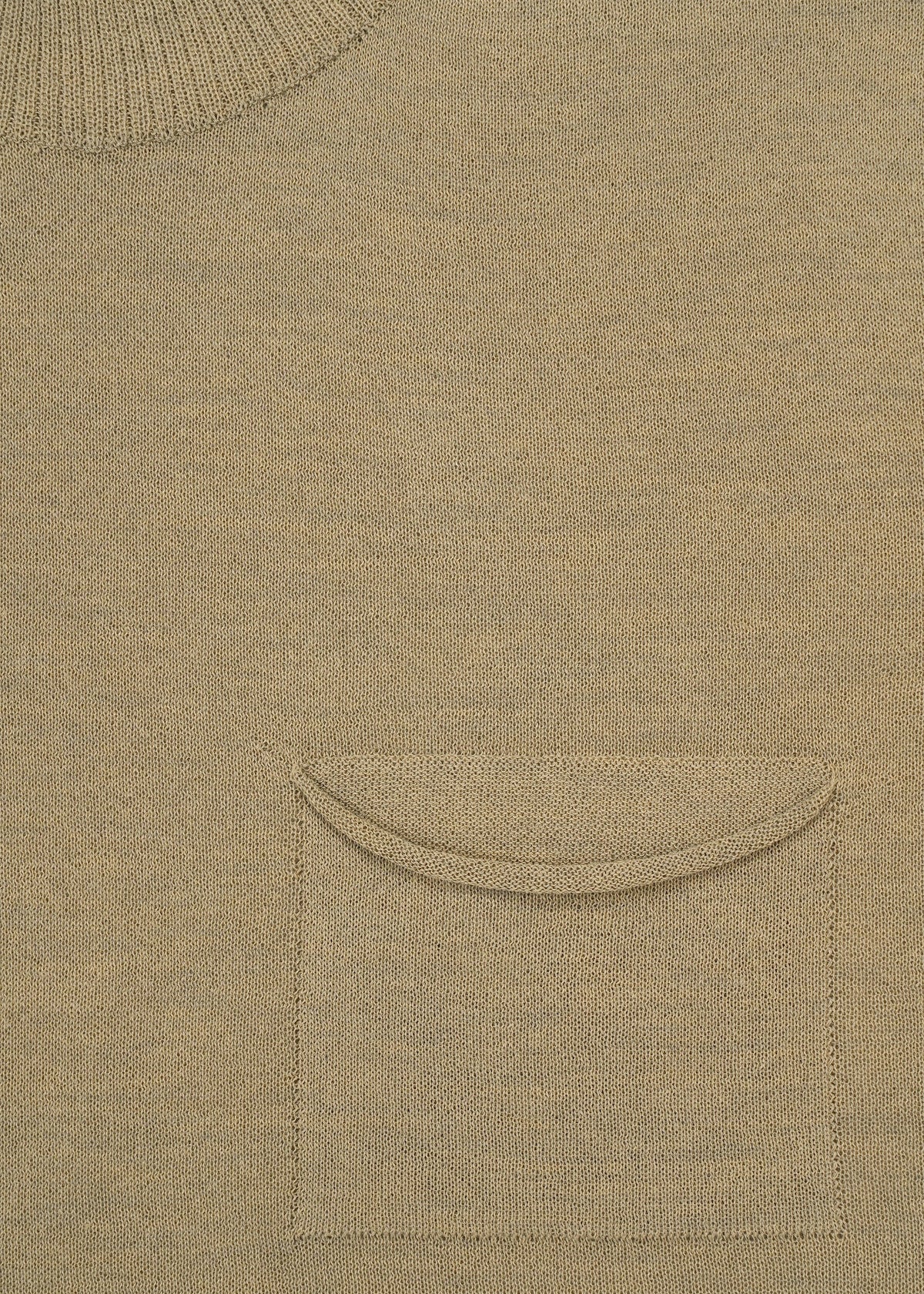 Close-up of the AIRY POCKET LAYERS by HaaT in beige, highlighting the minimalist neckline at the top left and a small chest pocket with a curved flap near the center. The fabric texture of this polyester wool blend is clearly visible. view 5 of 8