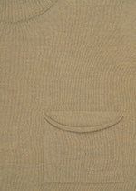 Close-up of the AIRY POCKET LAYERS by HaaT in beige, highlighting the minimalist neckline at the top left and a small chest pocket with a curved flap near the center. The fabric texture of this polyester wool blend is clearly visible.