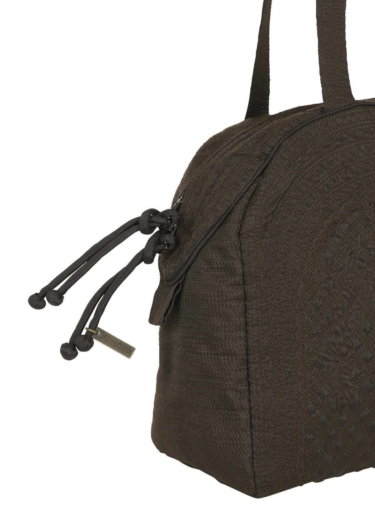 Close-up of the BLOOM & PLAID BOSTON by HaaT, a dark brown textured Boston bag featuring double handles and decorative knotted zipper pulls. A small rectangular metal tag dangles from one of the zippers, showcasing its artisanal charm and fine craftsmanship made in India. view 4 of 7