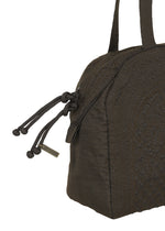 Close-up of the BLOOM & PLAID BOSTON by HaaT, a dark brown textured Boston bag featuring double handles and decorative knotted zipper pulls. A small rectangular metal tag dangles from one of the zippers, showcasing its artisanal charm and fine craftsmanship made in India.