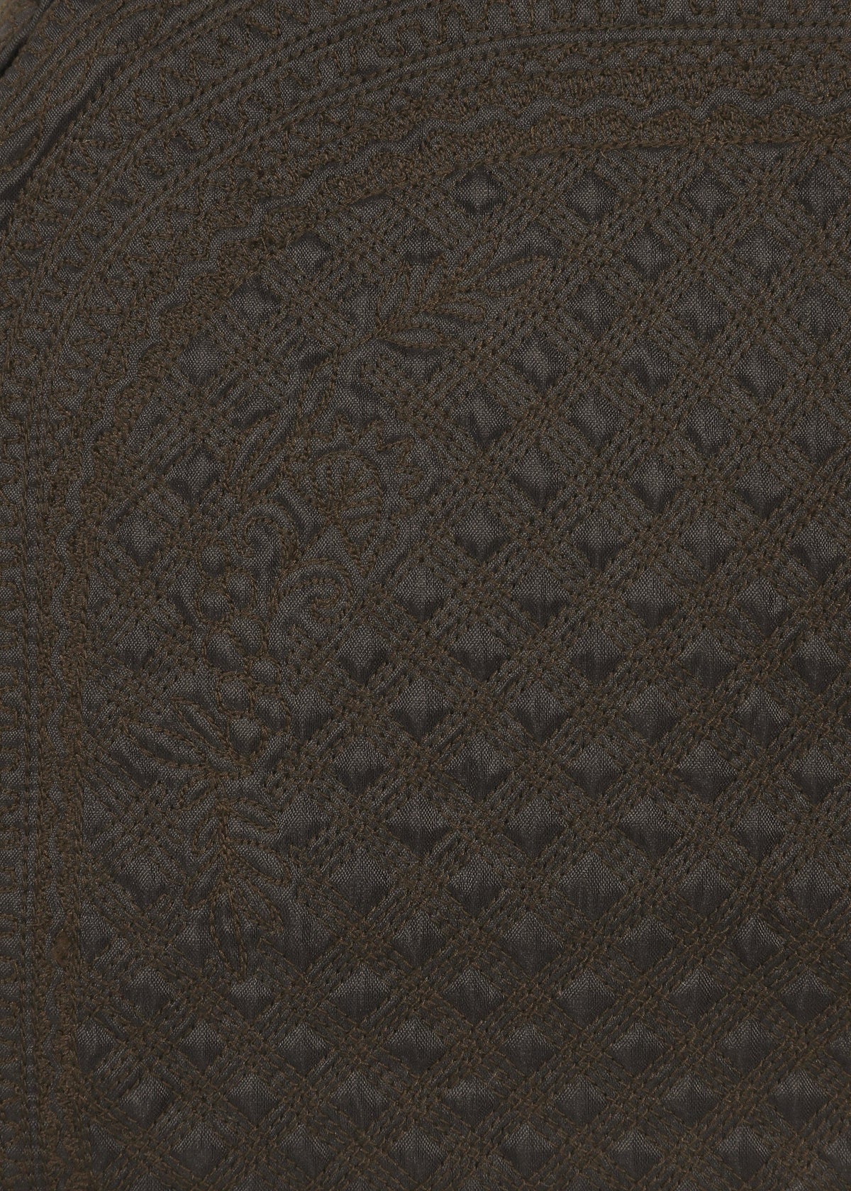 Close-up of dark brown textured fabric featuring diamond-shaped stitching and intricate, swirling Bhill embroidery patterns that create a detailed, decorative design—perfect for the BLOOM & PLAID BOSTON bag by HaaT, crafted in India. view 5 of 7