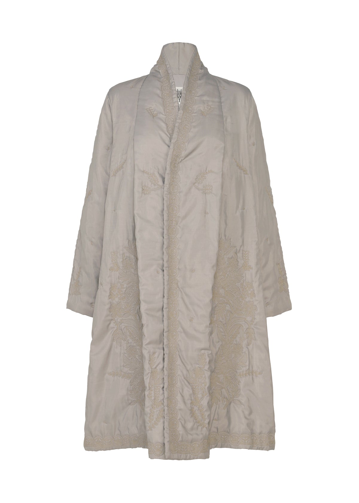 The HaaT DELICATE FLORAL BHILL is a beige, knee-length quilted evening coat with long sleeves, a shawl collar, and subtle Bhill floral embroidery, shown against a plain white background. view 1 of 9