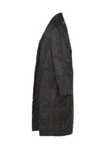 Side view of the DELICATE FLORAL BHILL, a long black quilted evening coat by HaaT with large front pockets, collar, and subtle botanical patterns, shown on a white background.