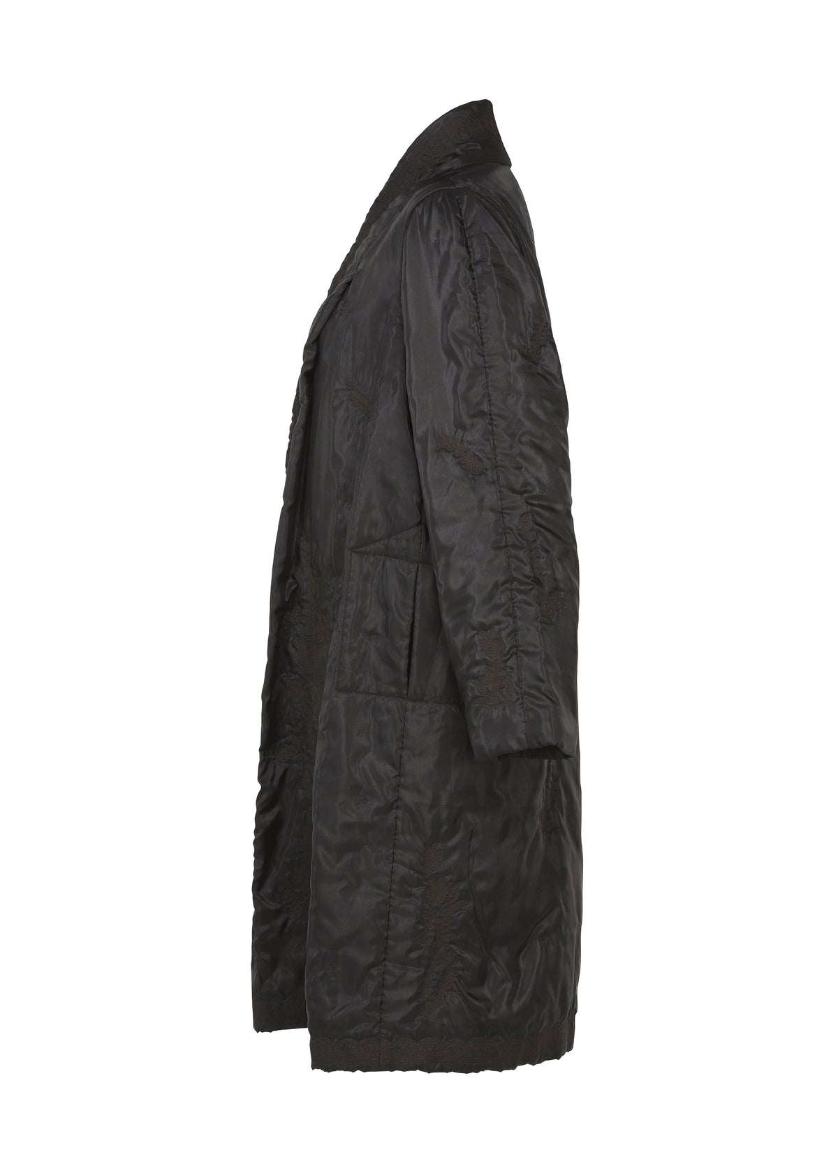 Zoomed view Side view of the DELICATE FLORAL BHILL, a long black quilted evening coat by HaaT with large front pockets, collar, and subtle botanical patterns, shown on a white background.