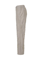Side view of HaaT’s DELICATE FLORAL BHILL: light beige, high-waisted, ankle-length nylon pants with a relaxed fit, elastic waistband, and subtle botanical Bhill embroidery against a white background.
