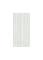 The PLEATS BAND from HOMME PLISSÉ ISSEY MIYAKE is a light-colored, rectangular cloth featuring vertical pinstripes, neatly folded and set against a white background. - DUOMO GREEN (no.60)