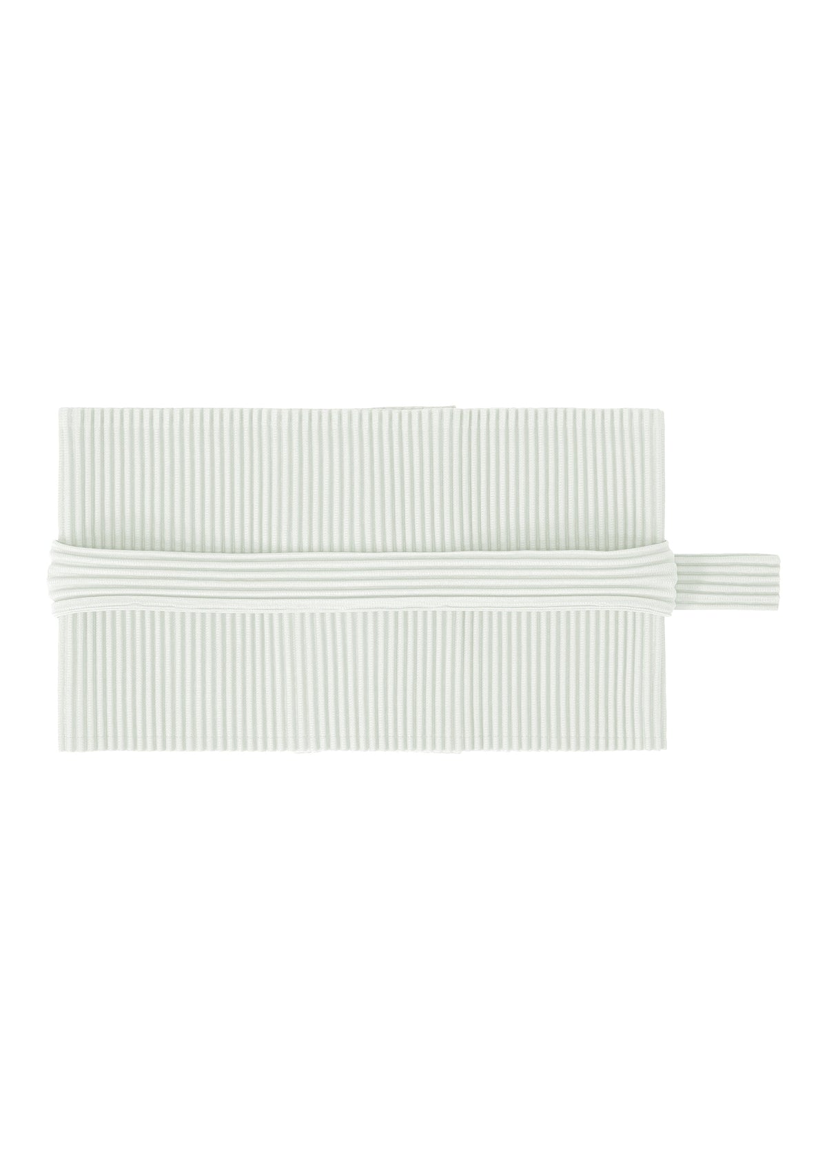 A white, rectangular pleated napkin by HOMME PLISSÉ ISSEY MIYAKE is neatly folded with a matching PLEATS BAND—a tube-shaped fabric ring—encircling its center. view 2 of 8