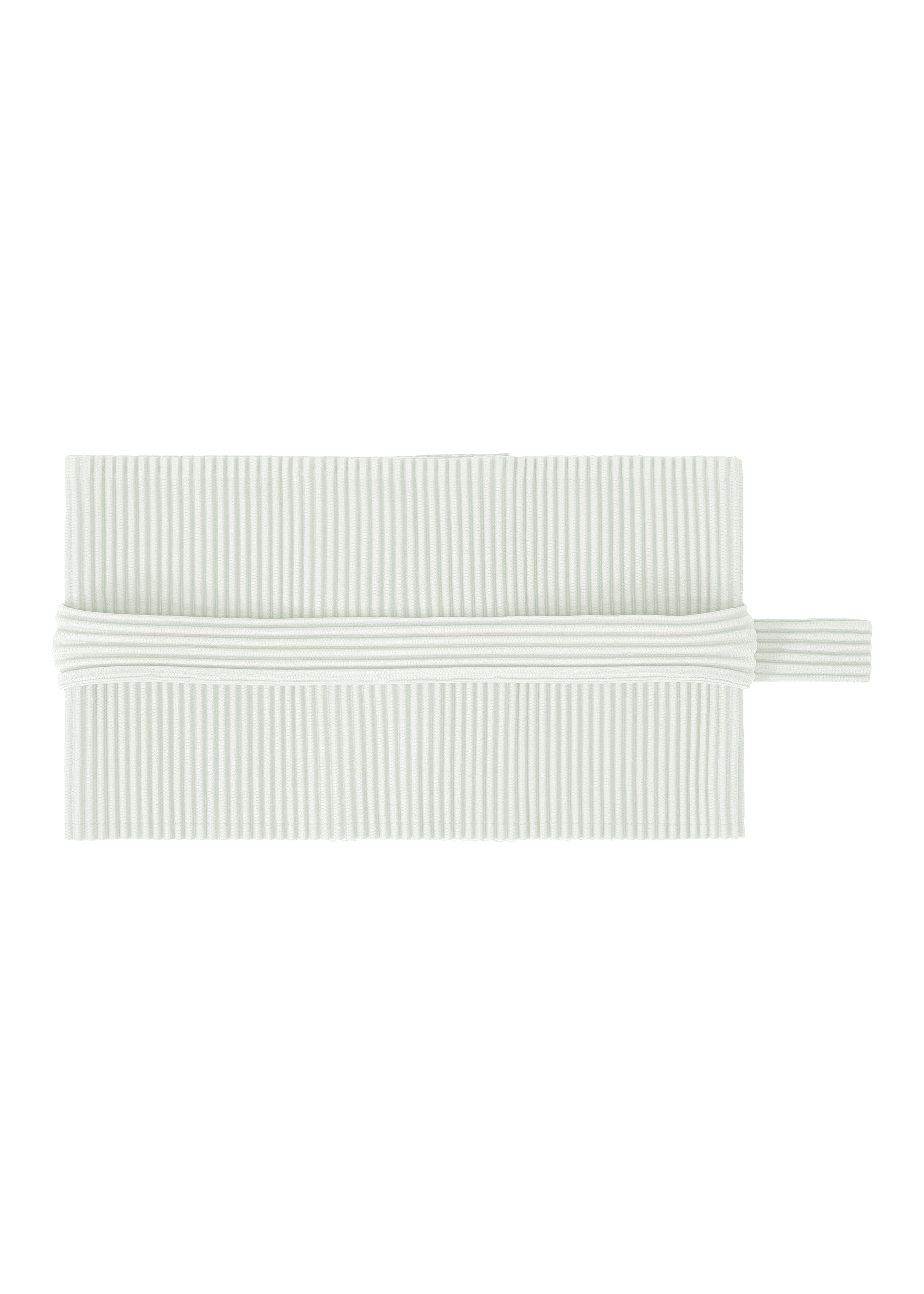 Zoomed view A white, rectangular pleated napkin by HOMME PLISSÉ ISSEY MIYAKE is neatly folded with a matching PLEATS BAND—a tube-shaped fabric ring—encircling its center. - DUOMO GREEN (no.60)