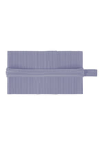 The PLEATS BAND by HOMME PLISSÉ ISSEY MIYAKE is a flat, rectangular piece of light purple ribbed tube-shaped fabric with a matching ribbed band at the center—comfortable for year-round wear. - MANAROLA WALL VIOLET (no.80)
