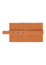The PLEATS BAND by HOMME PLISSÉ ISSEY MIYAKE is a ribbed, orange, rectangular tube-shaped fabric with three dark circular buttons, designed for year-round comfort and shown folded on a white background.