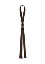 The PLEATED SEERSUCKER TIE by HOMME PLISSÉ ISSEY MIYAKE features a brown, ribbed fabric with a central band and two loose ends, creating a playful accessory that stands out against a plain white background. - BROWN （no.44）