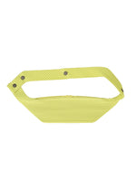 The VERSATILE CROSSBODY by HOMME PLISSÉ ISSEY MIYAKE is a yellow, ribbed-texture bag with a wide strap and three metallic snap buttons, shown on a white background. - ZUCCHINI YELLOW （no.53）
