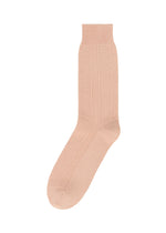 The HOMME PLISSÉ ISSEY MIYAKE STEM SOCKS feature a light pink hue, textured knit pattern, ribbed cuff, and smooth toe and heel, demonstrating quality craftsmanship and shown on a white background. - PINK （no.22）