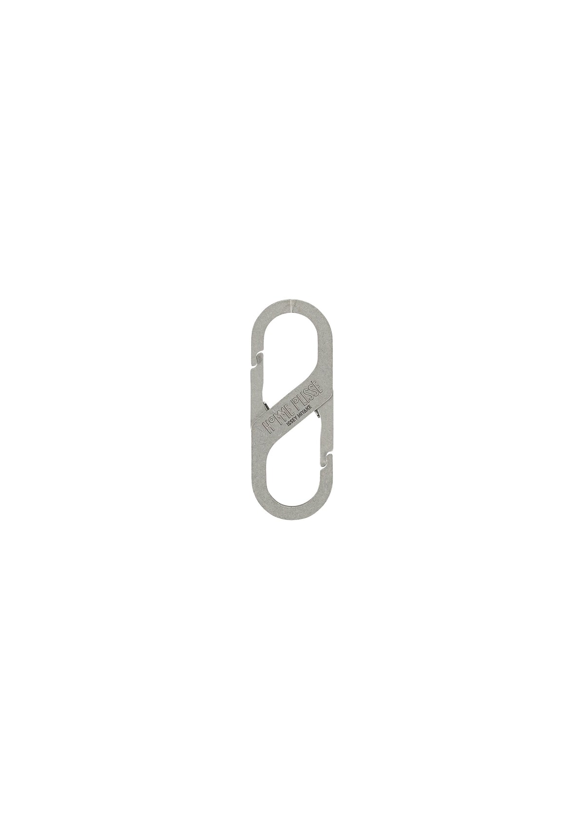 The HOMME PLISSÉ ISSEY MIYAKE CARABINER is a small, silver, metal S-shaped connector with two spring-loaded gates, resembling a double-ended carabiner and ideal as a belt loop accessory, shown against a white background. view 2 of 5