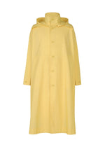 The FRESHEN coat by HOMME PLISSÉ ISSEY MIYAKE is a long yellow hooded coat with button-down front, long sleeves, high collar, and a subtle wrinkled wash texture, shown against a plain white background.