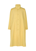 The FRESHEN coat by HOMME PLISSÉ ISSEY MIYAKE is a long, light yellow design with a high collar, front button closures, and wide sleeves. Its subtly wrinkled fabric adds dimension while keeping a smooth, slightly shiny finish.