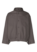 The CARRIER CARRIED jacket by HOMME PLISSÉ ISSEY MIYAKE is a loose-fitting, dark gray, water-repellent polyester button-up with a high collar, elastic hem, wide sleeves, and two side pockets, shown on a white background. - CHARCOAL （no.14）