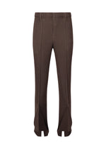 The LINEN LIKE pants by HOMME PLISSÉ ISSEY MIYAKE feature a brown ribbed knit, high waist, flared legs, and gathered hem for a dimensional look, showcased on a white background. - BROWN （no.44）