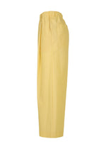 The FRESHEN pants by HOMME PLISSÉ ISSEY MIYAKE are light yellow, high-waisted, wide-leg with pleats, an elastic waistband, and a subtle wrinkled texture. Shown from the side against a white background.