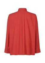 The STREAMLINE SHIRT by HOMME PLISSÉ ISSEY MIYAKE features long sleeves, a regular collar, and buttoned cuffs in red organic cotton, shown from the back against a white background.