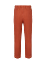 The TAILORED PLEATS 3 pants by HOMME PLISSÉ ISSEY MIYAKE are rust-orange, straight-leg trousers with an elastic waistband and quick-drying polyester, shown on a plain white background.