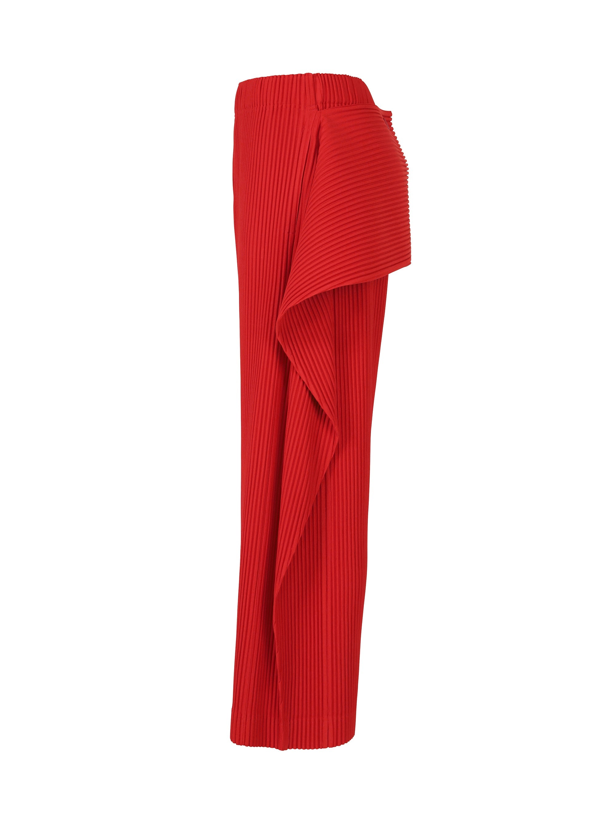 Zoomed view The COVER AND FOLD bright red pleated pants by HOMME PLISSÉ ISSEY MIYAKE feature a high waist and asymmetrical draped panel, showcasing architectural design on a white background.