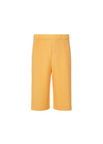The WEAR OR WRAP knee-length ribbed orange pleated shorts by HOMME PLISSÉ ISSEY MIYAKE feature an elastic waistband and are displayed against a plain white background. - CT STEEL YELLOW （no.55）