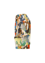 PALETTE MARBLED knee-length shorts by HOMME PLISSÉ ISSEY MIYAKE, featuring a vibrant handcrafted marble print in blue, orange, green, and beige with a gathered waistband and fabric tie belt. Shown on a plain white background.
