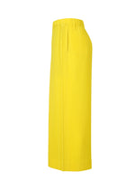 Side view of the COLORFUL PLEATS BOTTOMS by HOMME PLISSÉ ISSEY MIYAKE, a bright yellow pleated polyester midi skirt with an elastic waistband and pockets, shown against a plain white background.