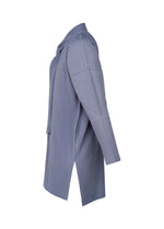 Side view of the HOMME PLISSÉ ISSEY MIYAKE MONTHLY COLORS : FEBRUARY shirt, long-sleeved with a necktie neckline, collar, open side seam, and light blue pleats, shown against a white background.