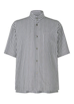 The STRIPE JERSEY by HOMME PLISSÉ ISSEY MIYAKE is a relaxed-fit, short-sleeved shirt with a standing collar, black and white vertical stripes, and a chest pocket—offering a balanced formal-casual style. - BLUE (no.72)