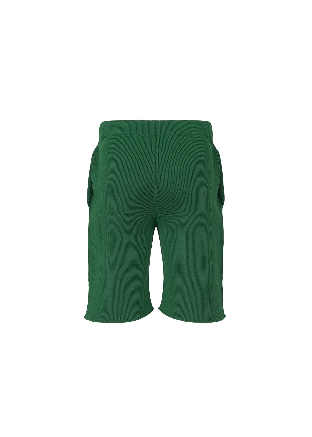 The BASIC KNIT shorts by HOMME PLISSÉ ISSEY MIYAKE are shown from the back, featuring an elastic waistband and two side pockets. Inspired by the pleated jersey shorts signature to the brand, these green knit shorts are displayed against a plain white background. view 3 of 6
