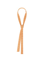 The MESH PLEATS TIE by HOMME PLISSÉ ISSEY MIYAKE, featuring a tan, braided design reminiscent of soft fabric, is styled in a simple knot with two long ends draping downward and a loop at the top, displayed against a plain white background. - ORANGE （no.32）